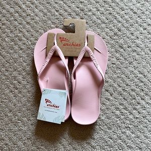 Womens pink Archie’s flip flops